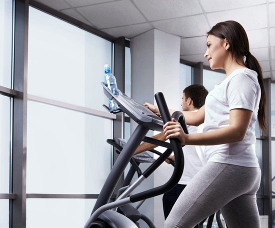 lady working out on elliptical