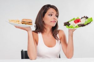 woman struggling to decide whether to diet