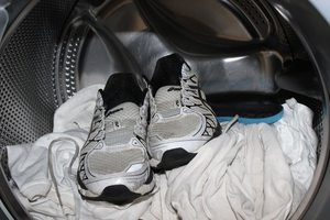 muddy shoes being cleaned in a washer