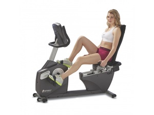 woman working out on a recumbent bike at home