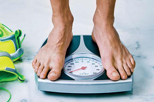 man standing on a weight scale
